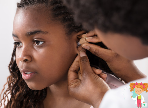 Child having her ears checked